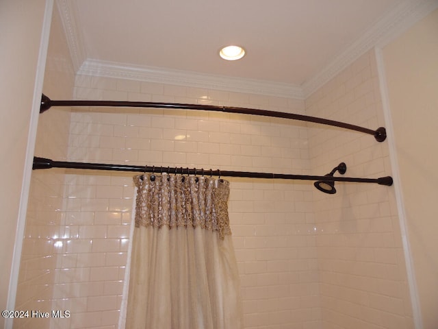 interior details with ornamental molding and walk in shower