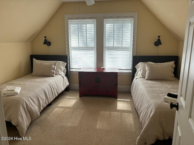 carpeted bedroom with lofted ceiling and ceiling fan