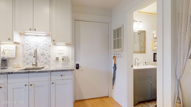 bathroom featuring hardwood / wood-style floors and vanity