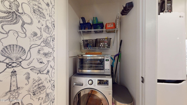 washroom featuring washer / clothes dryer