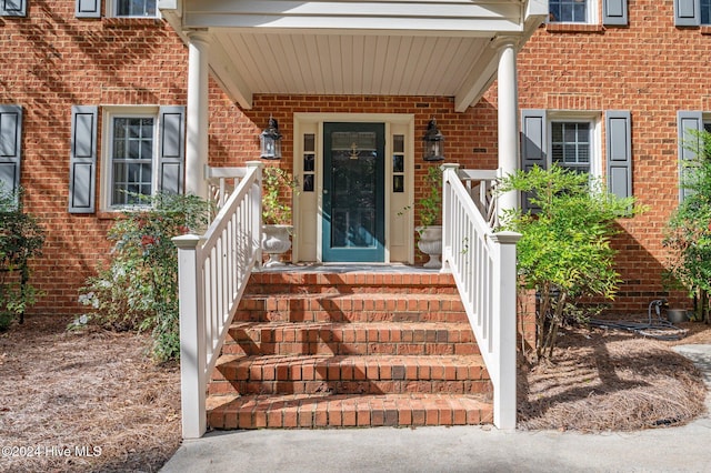 property entrance featuring covered porch