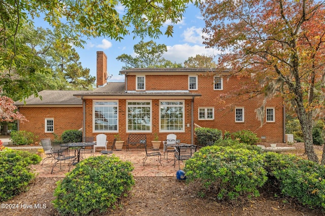 back of property featuring a patio