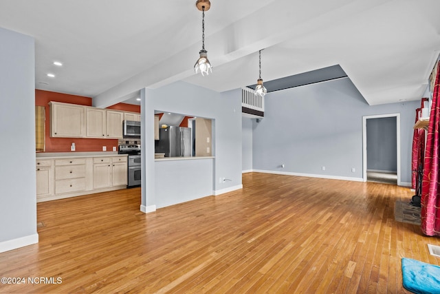 unfurnished living room with beam ceiling and light hardwood / wood-style flooring