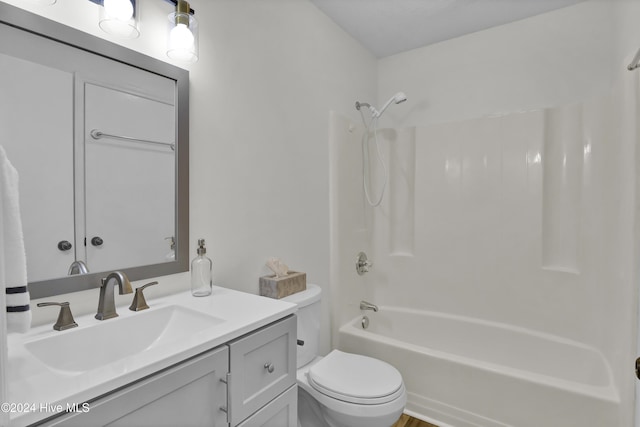 full bathroom with shower / bathing tub combination, vanity, and toilet