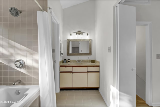 bathroom featuring tile patterned floors, vanity, and shower / bath combo with shower curtain