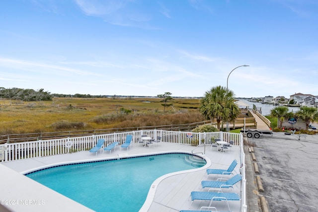 view of swimming pool with a patio