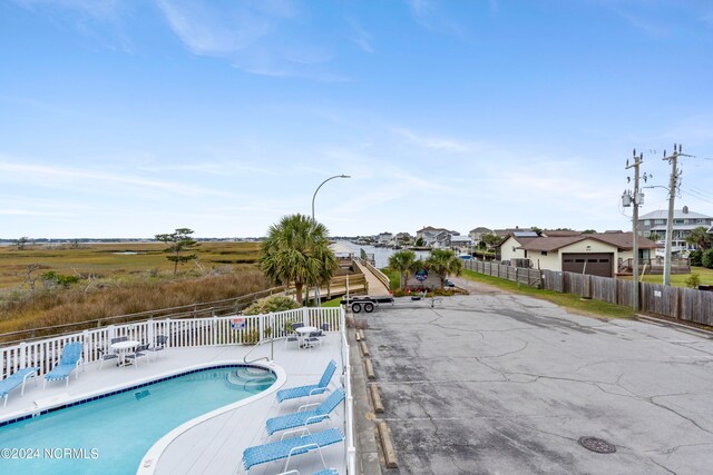 view of swimming pool featuring a patio