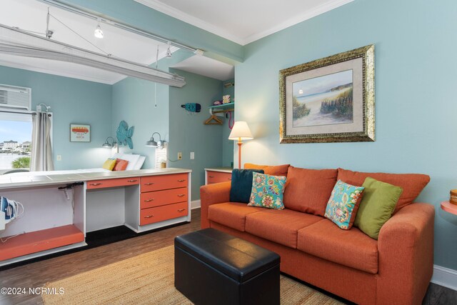 living room with ornamental molding, light hardwood / wood-style flooring, and rail lighting