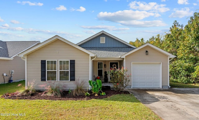 view of front facade featuring a front yard and a garage