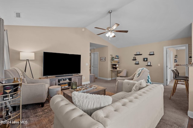 living room with ceiling fan, dark carpet, and lofted ceiling