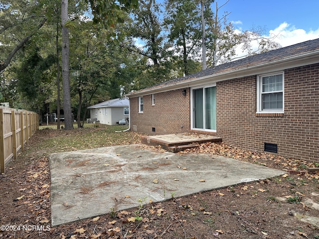 rear view of house featuring a patio