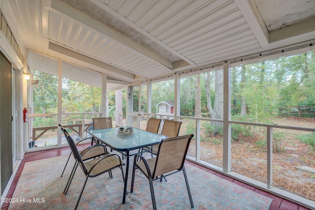 sunroom with beam ceiling