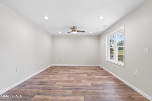 empty room featuring ceiling fan and wood-type flooring