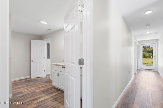 corridor featuring dark wood-type flooring