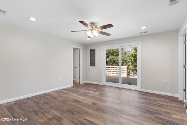 unfurnished room featuring ceiling fan and dark hardwood / wood-style flooring