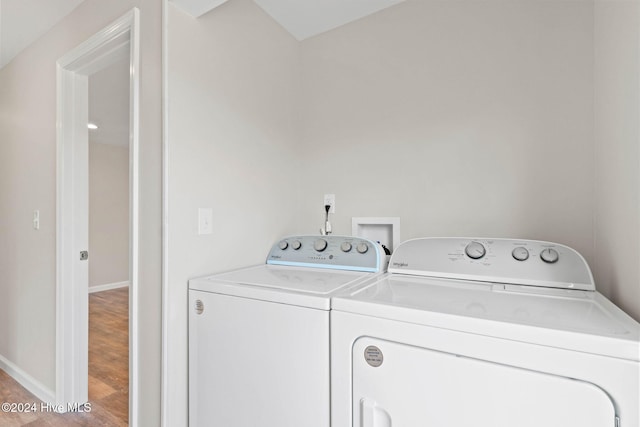 1070 Midway Rd SE, Bolivia, NC 28422 - washroom with washing machine and dryer, baseboards, and wood finished floors