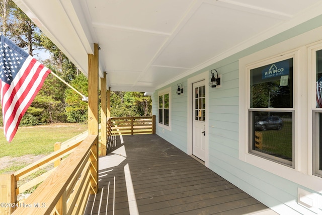 wooden deck featuring covered porch