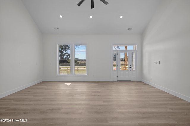 unfurnished room with ceiling fan and light hardwood / wood-style flooring