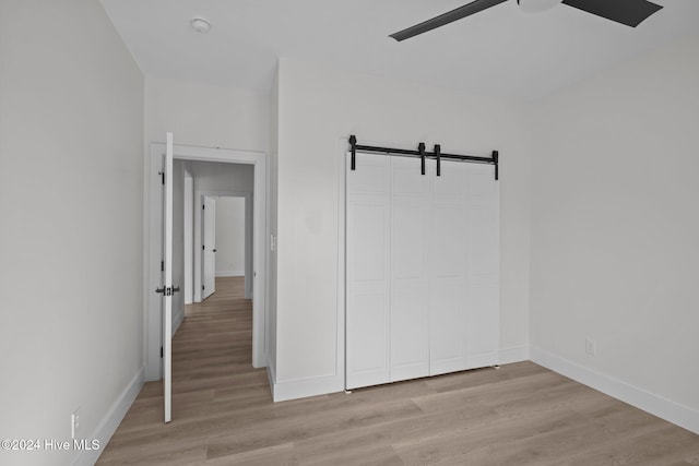 empty room featuring light hardwood / wood-style flooring and ceiling fan