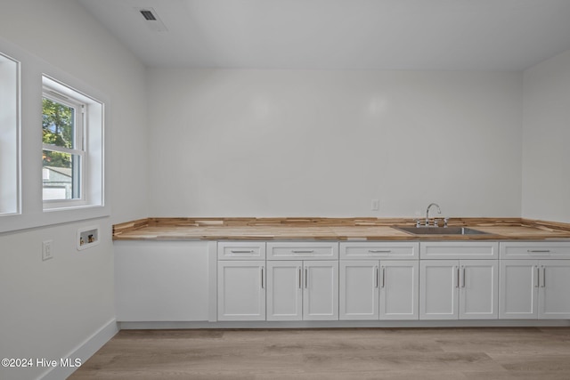 interior space featuring wood-type flooring and sink