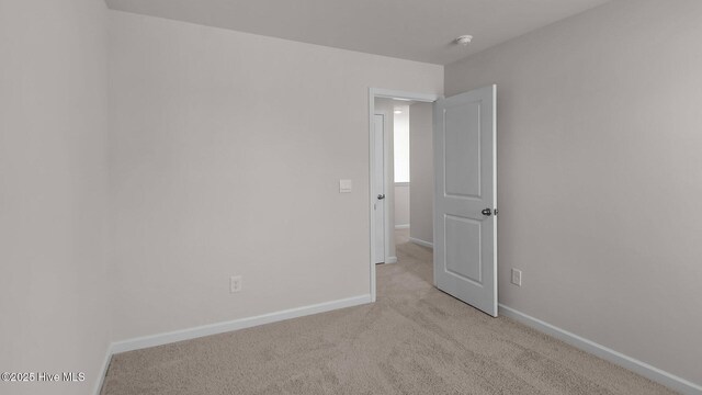 clothes washing area with washer / clothes dryer and hardwood / wood-style floors