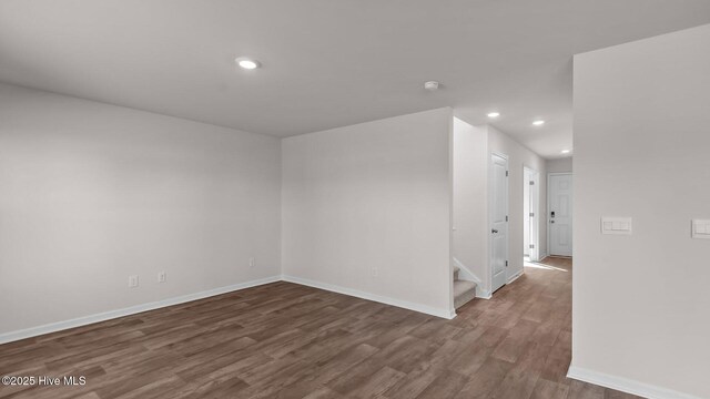 living room with hardwood / wood-style flooring and a healthy amount of sunlight