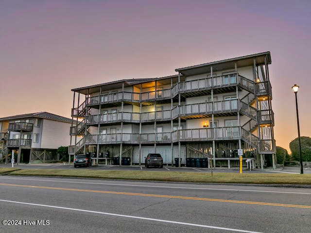 view of outdoor building at dusk