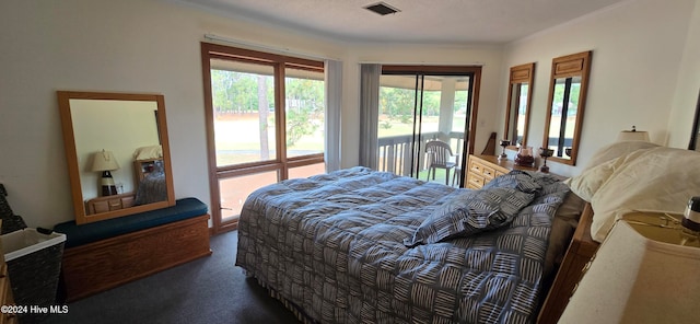 carpeted bedroom with access to outside