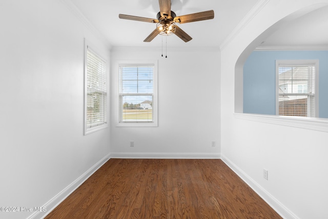 unfurnished room with ornamental molding, dark hardwood / wood-style floors, and a healthy amount of sunlight