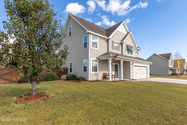 view of front of house featuring a front lawn and a garage