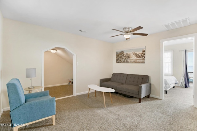 living room with ceiling fan and carpet floors