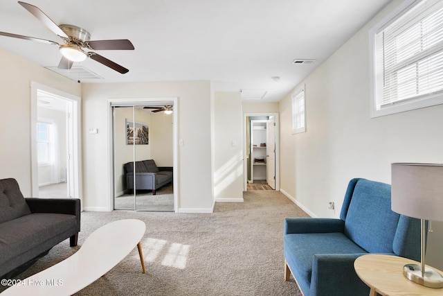 living room with light carpet and a healthy amount of sunlight