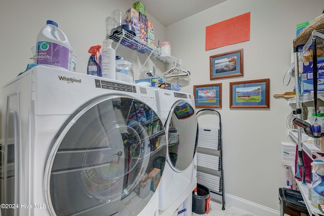 washroom with washing machine and clothes dryer