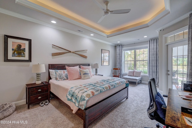 carpeted bedroom featuring crown molding, a raised ceiling, ceiling fan, and access to exterior