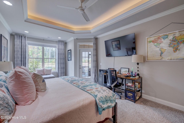 carpeted bedroom with access to outside, ceiling fan, a raised ceiling, and ornamental molding