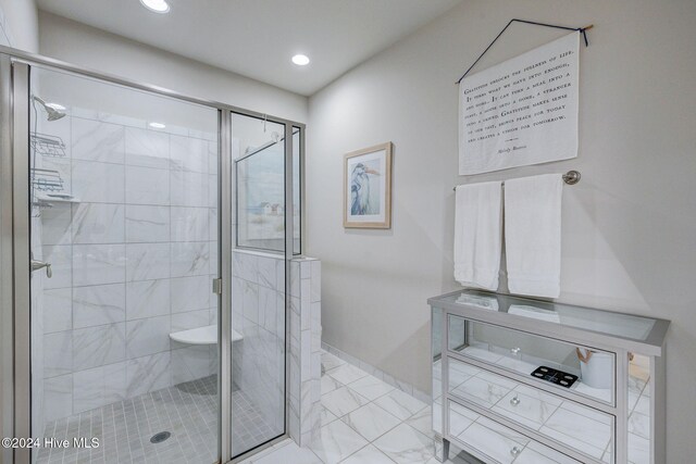 bathroom with a shower with shower door