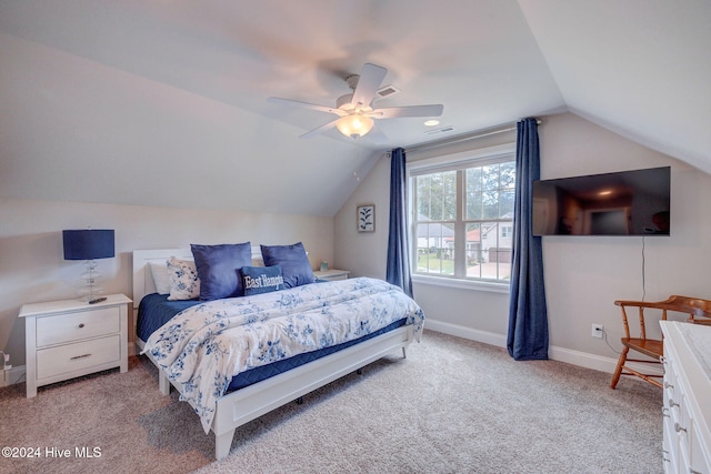 carpeted bedroom with lofted ceiling and ceiling fan