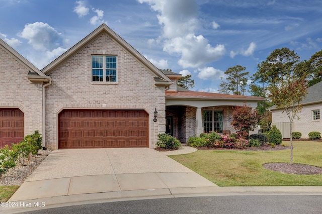 view of front of house with a garage and a front yard