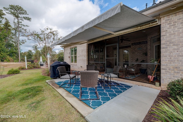 view of patio with ceiling fan and grilling area