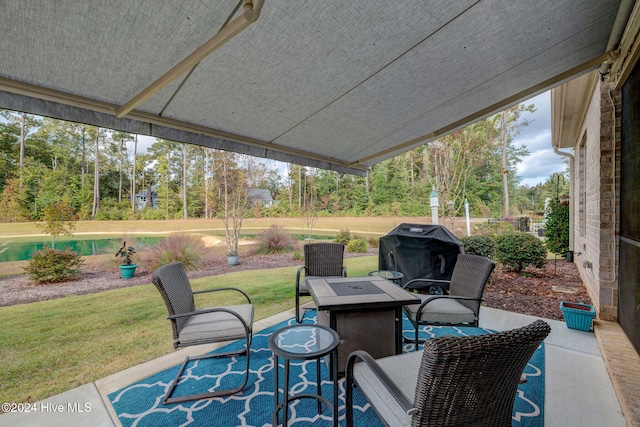 view of patio / terrace featuring an outdoor fire pit and a grill