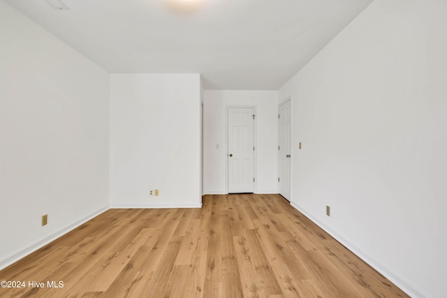 spare room featuring light hardwood / wood-style flooring