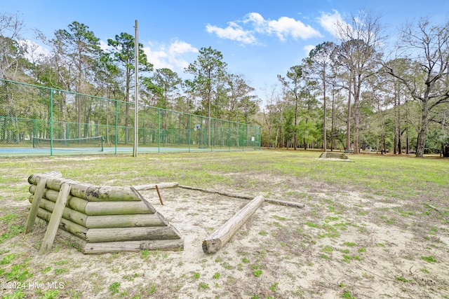 view of yard featuring tennis court