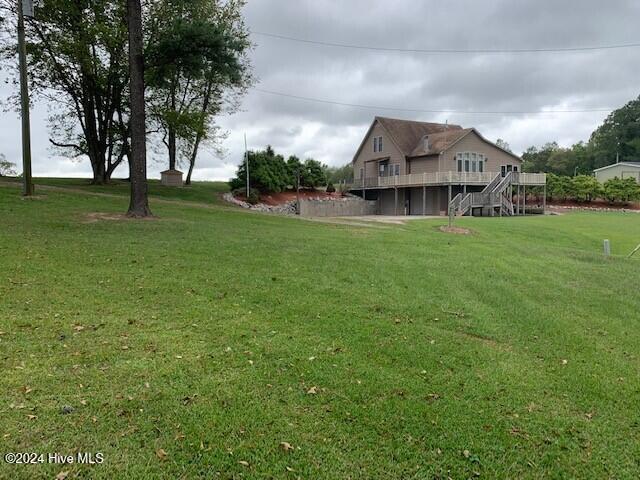 106 Summer Place Ln, Merry Hill, NC 27957 - view of green lawn with a deck and stairway
