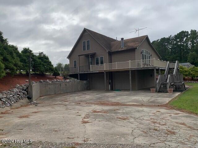 rear view of house with a garage