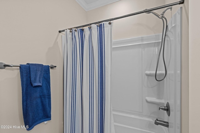 bathroom featuring shower / tub combo with curtain and ornamental molding