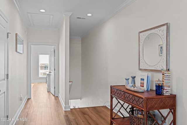 corridor featuring wood-type flooring and crown molding