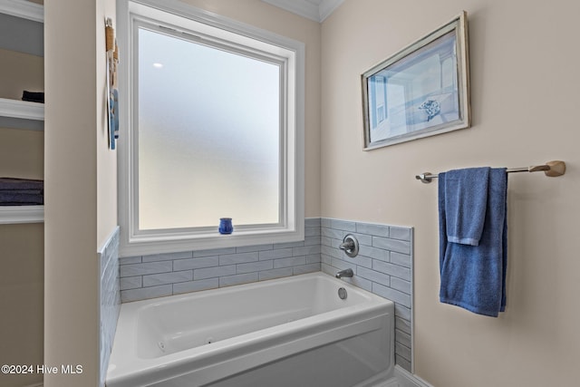 bathroom featuring a bath and ornamental molding