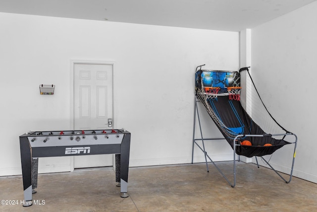 game room with concrete floors