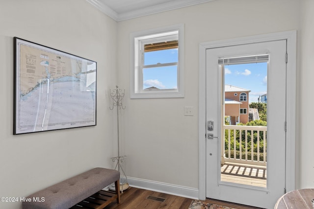 entryway featuring dark hardwood / wood-style floors and crown molding