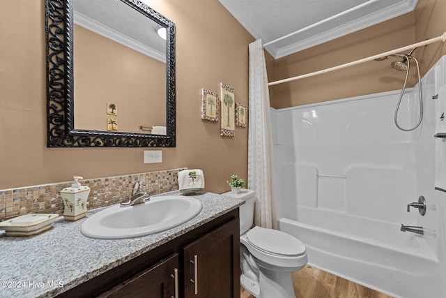 full bathroom with backsplash, shower / bathtub combination with curtain, toilet, vanity, and crown molding